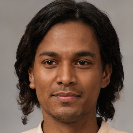 Neutral black young-adult male with medium  black hair and brown eyes