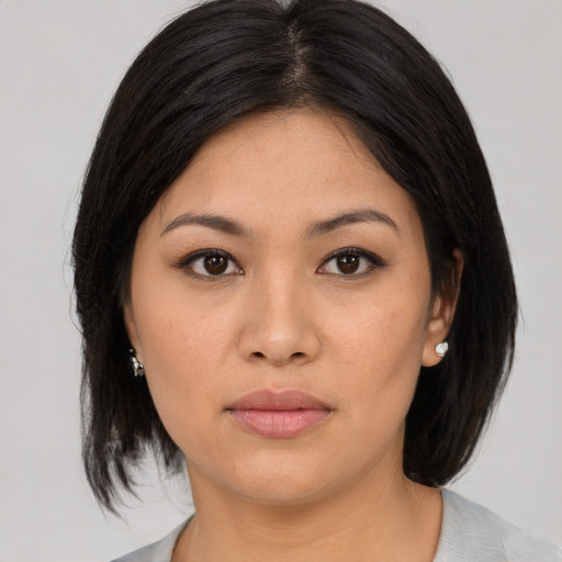 Neutral asian young-adult female with medium  black hair and brown eyes