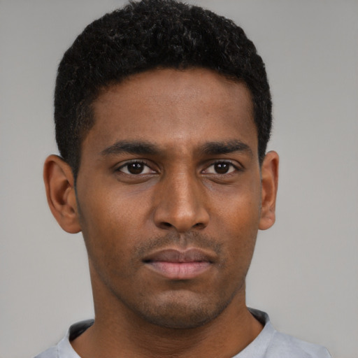 Neutral black young-adult male with short  black hair and brown eyes
