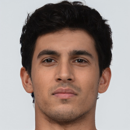 Neutral latino young-adult male with short  brown hair and brown eyes