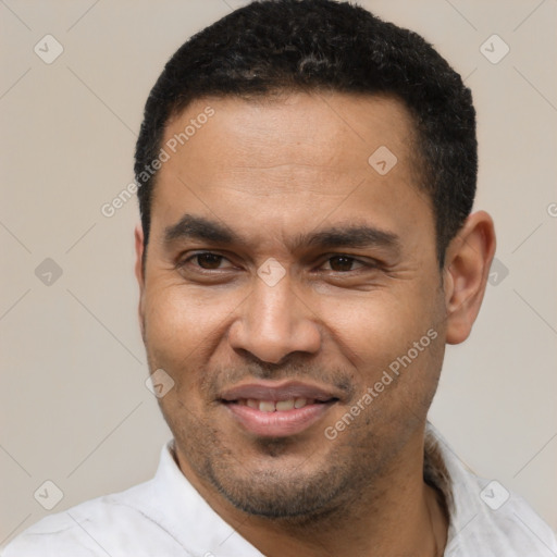 Joyful latino adult male with short  black hair and brown eyes