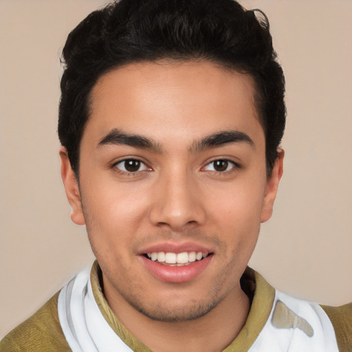 Joyful white young-adult male with short  black hair and brown eyes