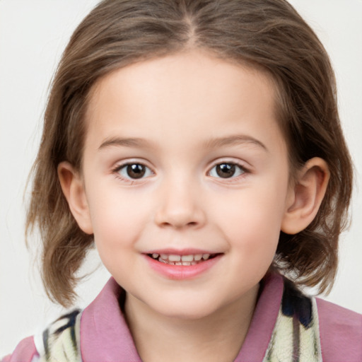 Joyful white child female with medium  brown hair and brown eyes