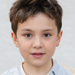Joyful white child male with short  brown hair and brown eyes