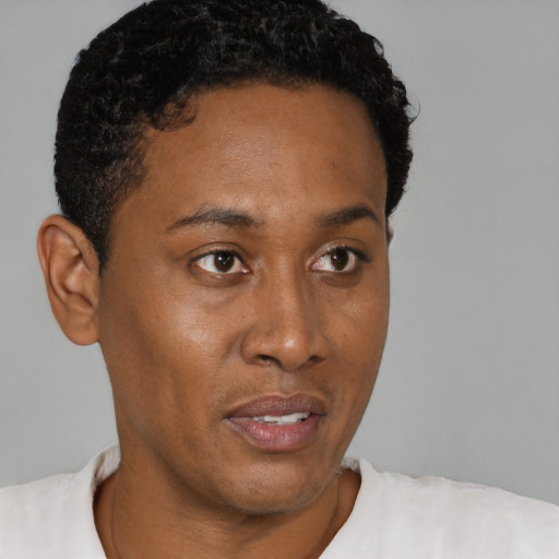Neutral black young-adult male with short  black hair and brown eyes