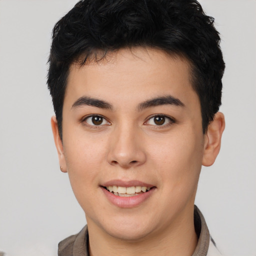 Joyful asian young-adult male with short  brown hair and brown eyes