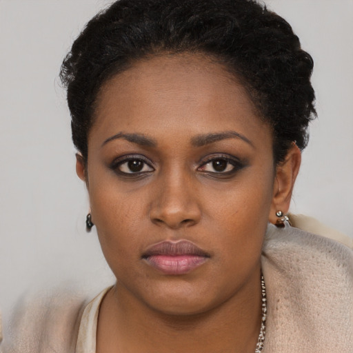 Neutral black young-adult female with short  brown hair and brown eyes