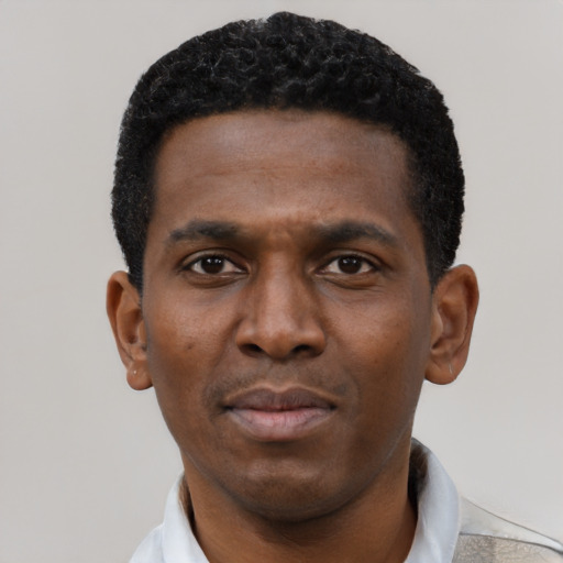 Neutral black young-adult male with short  black hair and brown eyes