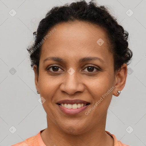 Joyful latino young-adult female with short  brown hair and brown eyes