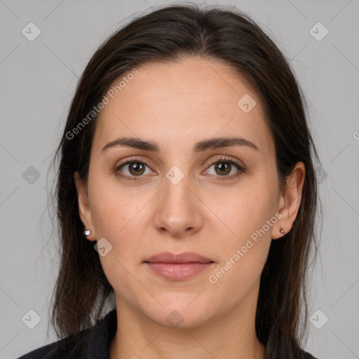 Joyful white young-adult female with long  brown hair and brown eyes