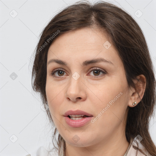 Joyful white adult female with medium  brown hair and brown eyes