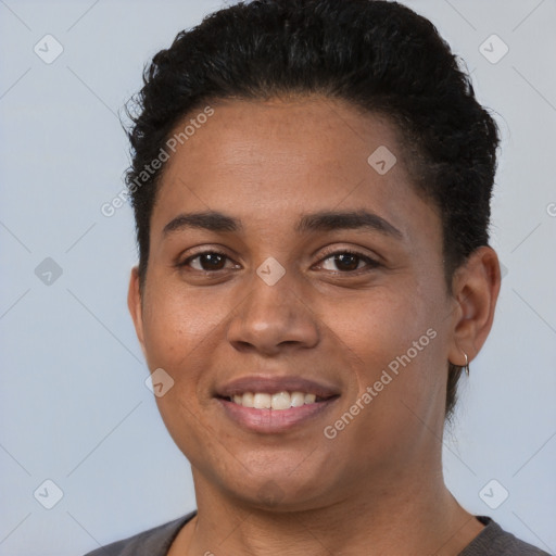 Joyful latino young-adult female with short  brown hair and brown eyes