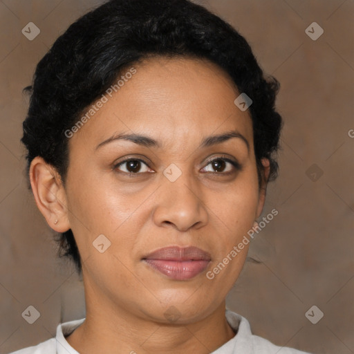 Joyful latino adult female with short  brown hair and brown eyes