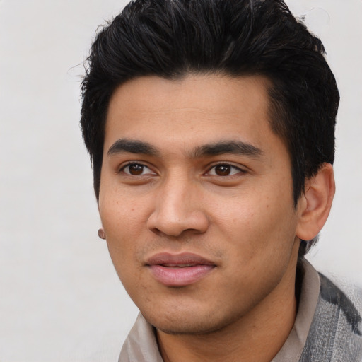 Joyful asian young-adult male with short  black hair and brown eyes