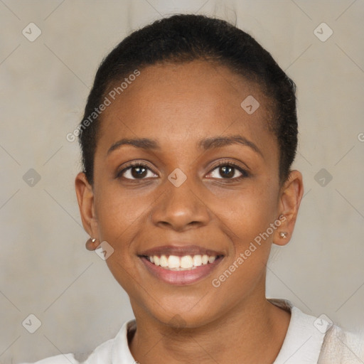 Joyful black young-adult female with short  brown hair and brown eyes