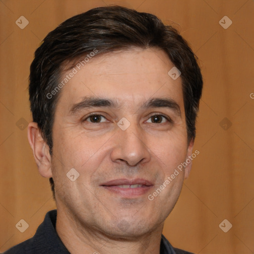 Joyful white adult male with short  brown hair and brown eyes