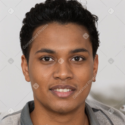 Joyful black young-adult male with short  brown hair and brown eyes