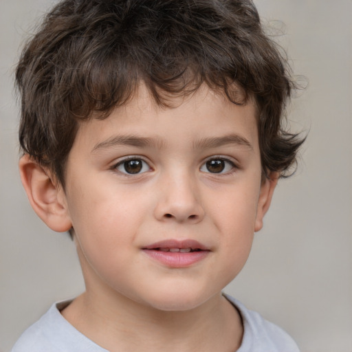 Joyful white child male with short  brown hair and brown eyes