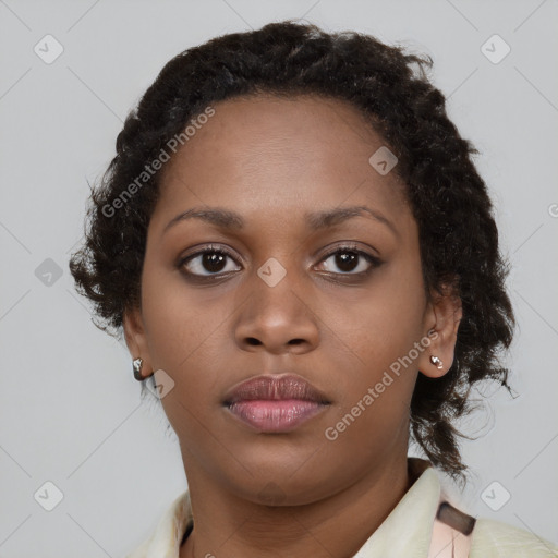 Neutral black young-adult female with medium  brown hair and brown eyes