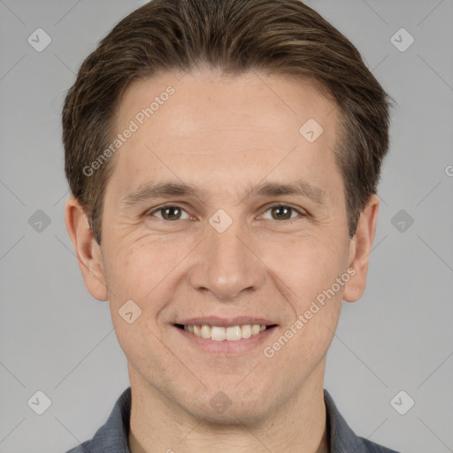 Joyful white adult male with short  brown hair and brown eyes