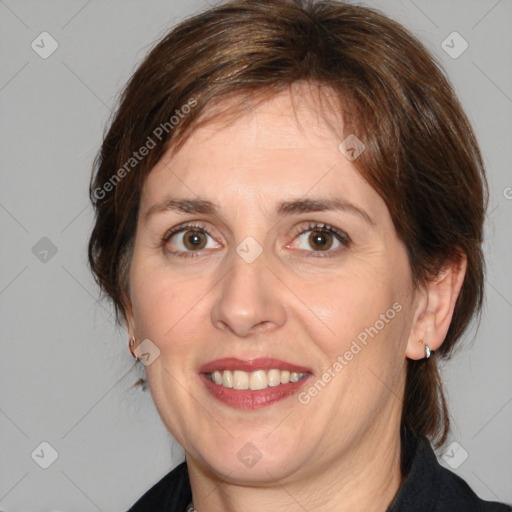 Joyful white adult female with medium  brown hair and brown eyes