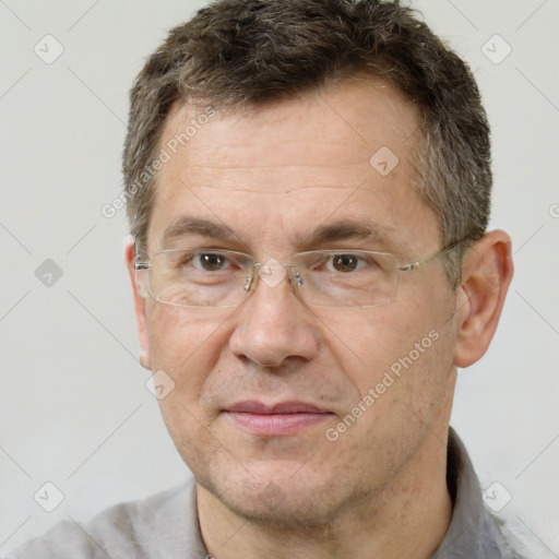 Joyful white adult male with short  brown hair and brown eyes