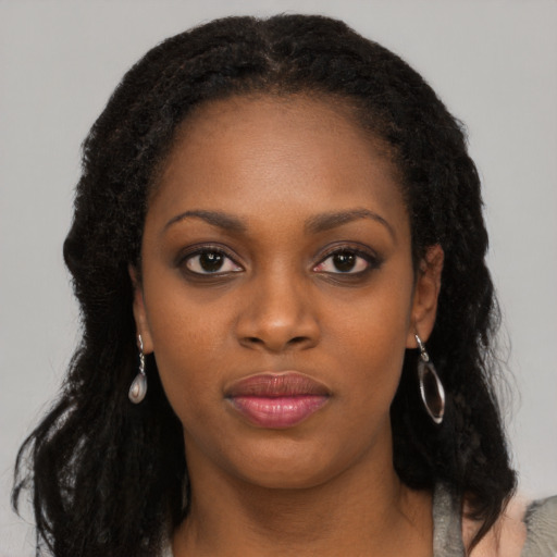 Neutral black young-adult female with long  black hair and brown eyes
