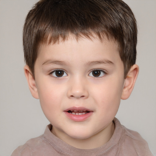 Joyful white child male with short  brown hair and brown eyes