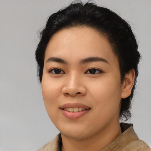 Joyful asian young-adult female with medium  black hair and brown eyes