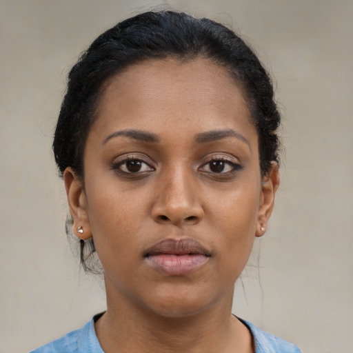 Neutral black young-adult female with short  brown hair and brown eyes
