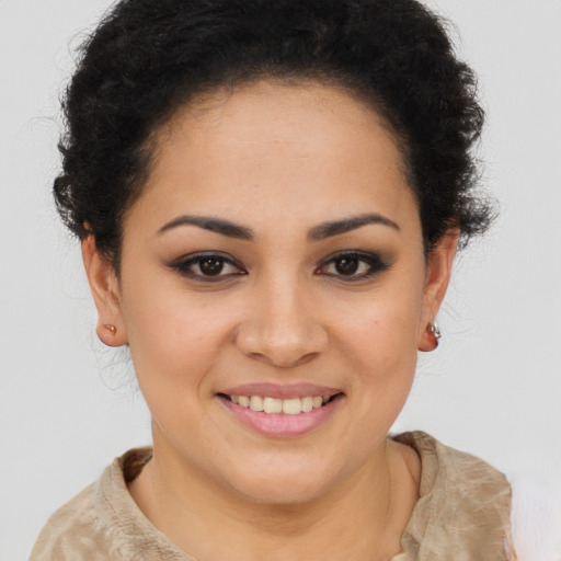 Joyful latino young-adult female with short  brown hair and brown eyes