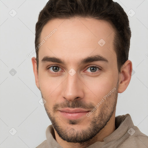 Neutral white young-adult male with short  brown hair and brown eyes