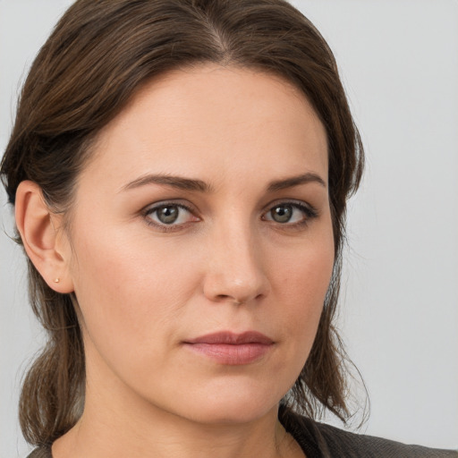 Neutral white young-adult female with medium  brown hair and grey eyes