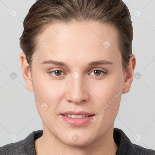 Joyful white young-adult female with short  brown hair and grey eyes