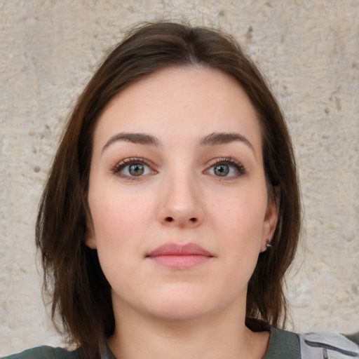 Neutral white young-adult female with medium  brown hair and grey eyes