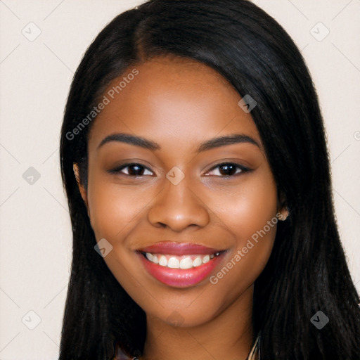 Joyful black young-adult female with long  black hair and brown eyes