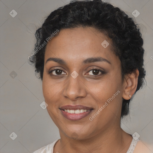 Joyful black young-adult female with short  brown hair and brown eyes