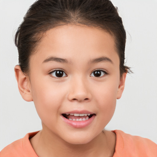 Joyful white child female with short  brown hair and brown eyes