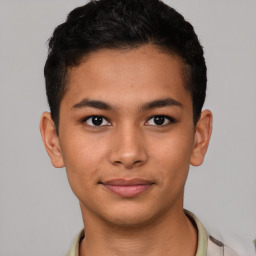 Joyful latino young-adult male with short  brown hair and brown eyes