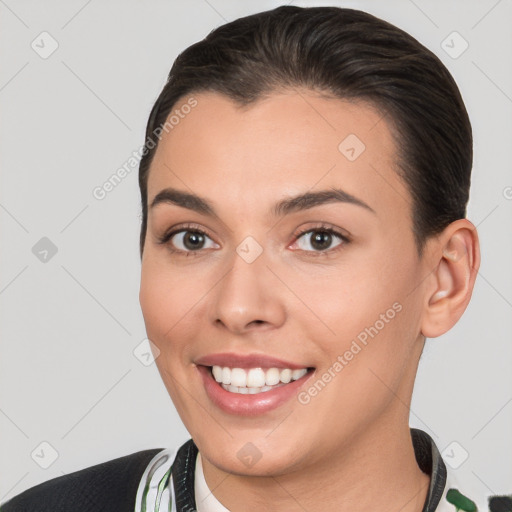 Joyful white young-adult female with short  brown hair and brown eyes