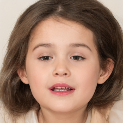 Joyful white child female with medium  brown hair and brown eyes