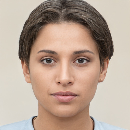 Neutral white young-adult female with short  brown hair and brown eyes