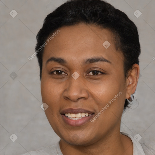 Joyful latino young-adult female with short  black hair and brown eyes