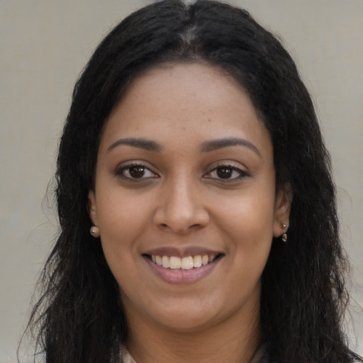 Joyful asian young-adult female with long  brown hair and brown eyes