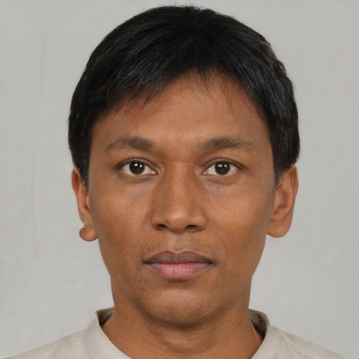 Neutral asian adult male with short  black hair and brown eyes