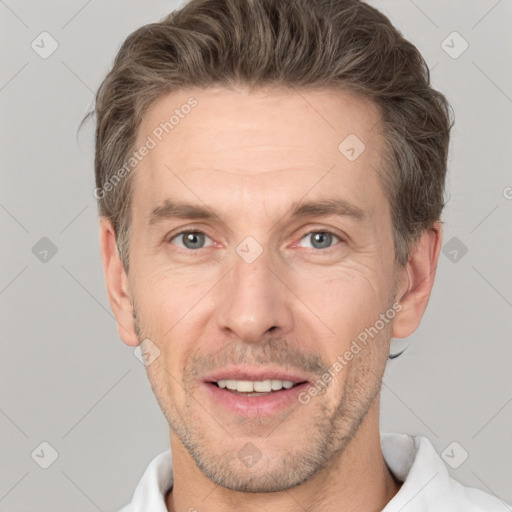 Joyful white adult male with short  brown hair and grey eyes