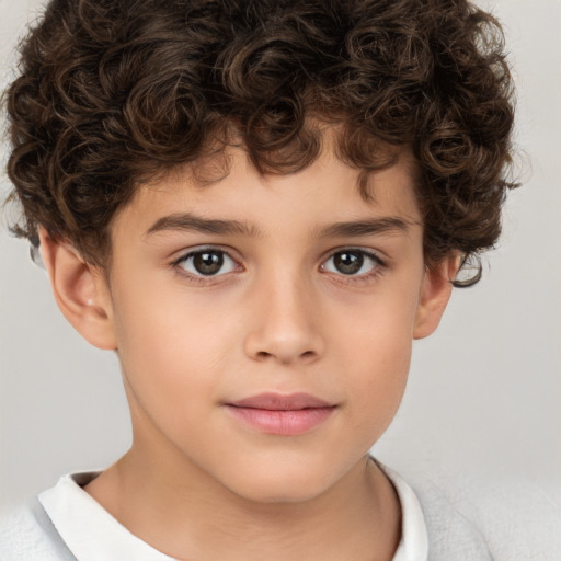 Joyful white child male with short  brown hair and brown eyes