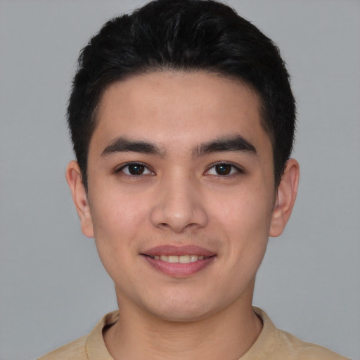 Joyful latino young-adult male with short  brown hair and brown eyes