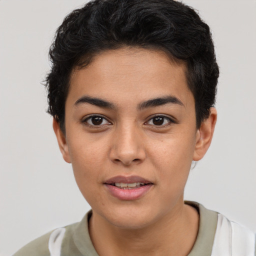 Joyful latino young-adult male with short  brown hair and brown eyes