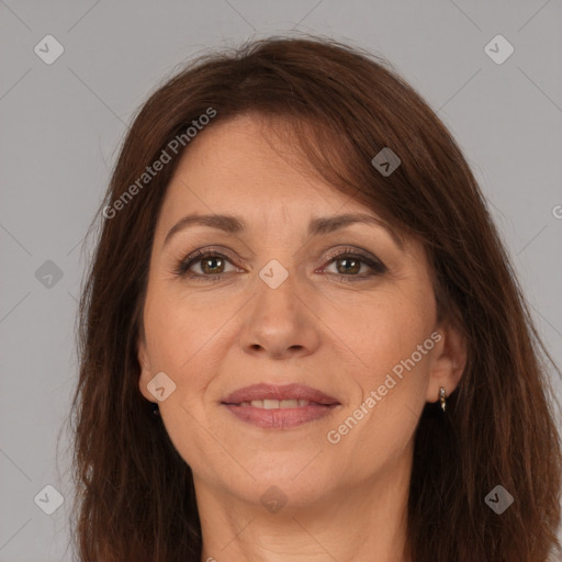 Joyful white adult female with long  brown hair and brown eyes